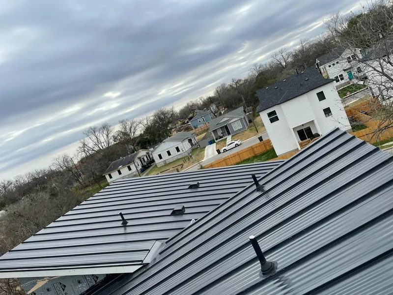 Standing seam metal roof panels with vents for Skylight Repair in Anoka